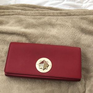 Deep red Kate Spade clutch